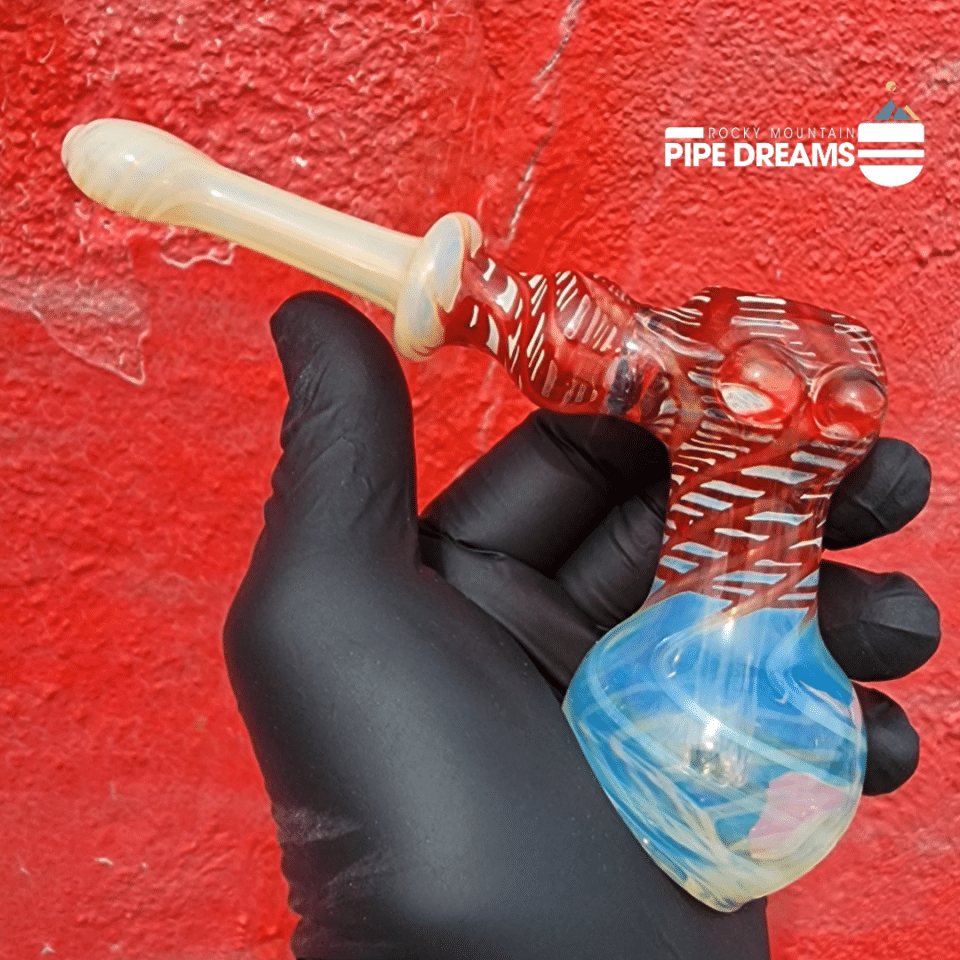 hand held water bubbler pipe 6,5 inches long with a 2inch base hammer style with red and blue like fumed glass work