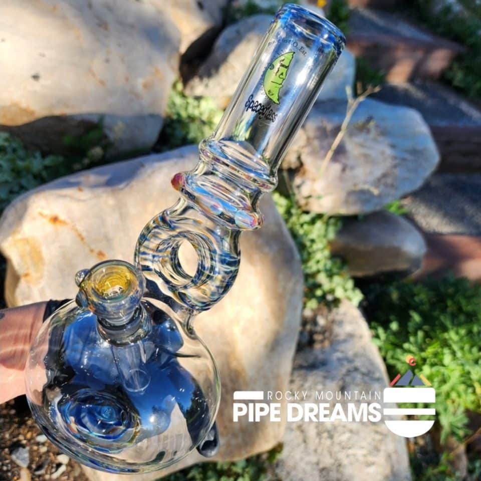 clear with blue decrative glass work with a round doughnut like glass circle in the center