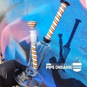 11 inches tall with a 4 inch base this water pipe is beautiful with orange red and white stripes and thick glass this waterpipe is one of kind and american made in Arizona