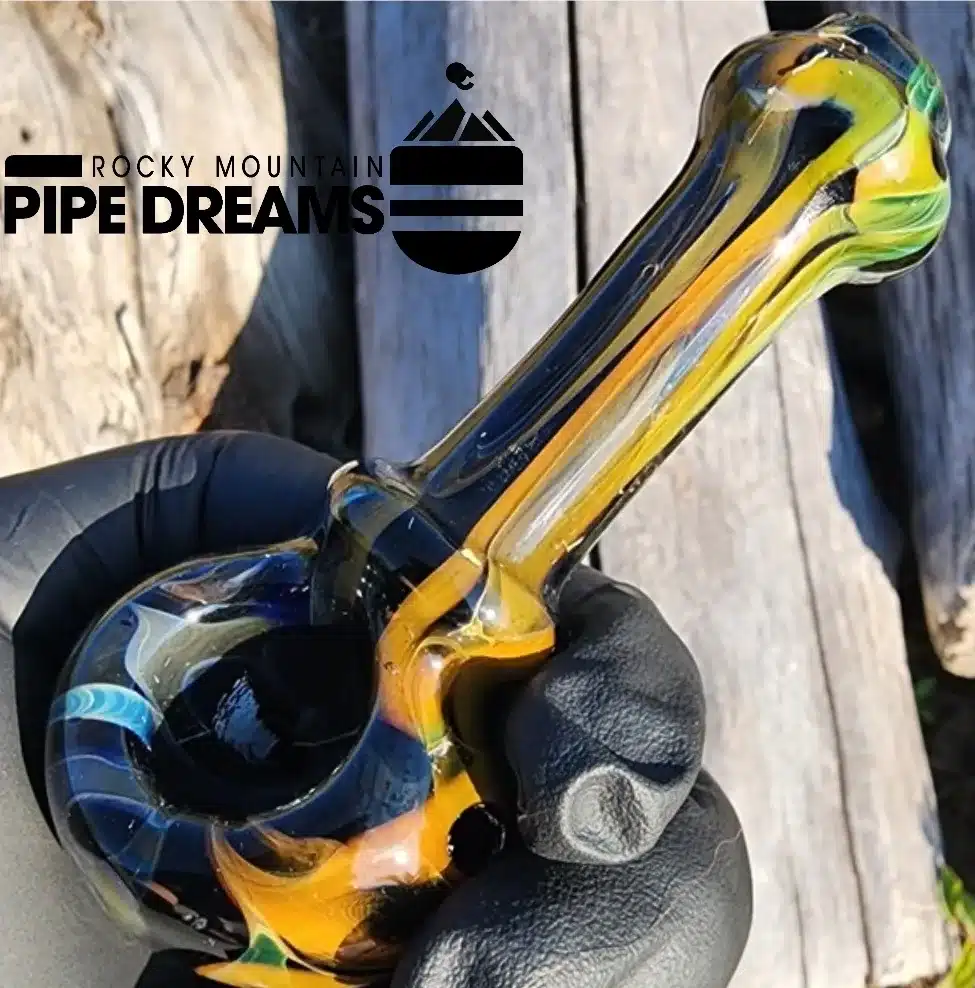 Hand pipe in black, gold, blue smoike colors made in Denver Colorado